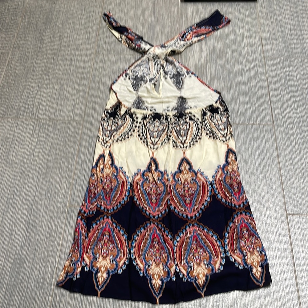 Brand new got as a gift size small can be worn many ways, cover up or dress